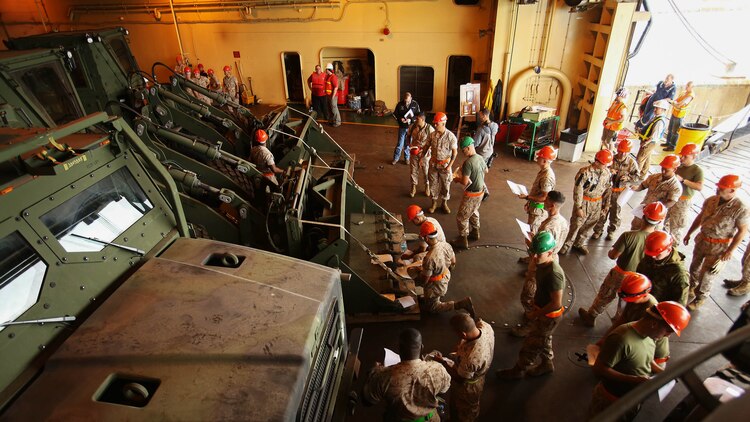Marines from 4th Light Armored Reconnaissance Battalion unload more than 130 pieces of cargo from the USNS Sergeant William R. Button in Rota, Spain, to prepare for Exercise Trident Juncture 15, the largest NATO exercise in ten years, Oct. 21. Trident Juncture includes more than 30 nations and 36,000 service members from 230+ units.