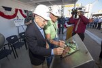 PASCAGOULA, Miss. - The keel of the future USS Paul Ignatius (DDG 117) is authenticated by the ship’s namesake, the Honorable Paul Ignatius (left) and Mr. Bill Jones, the Hull Superintendent (right) during a ceremony Oct. 20. Both authenticators etched their initials into the keel plate to symbolically recognize the joining of modular components and the ceremonial beginning of the ship. Paul Ignatius, a Flight IIA ship, is the first ship in the FY2013-FY2017 multi-year procurement contract to start fabrication and is scheduled to deliver in 2018. The ship will serve as an integral player in global maritime security, engaging in air, undersea, surface, strike and ballistic missile defense. (US Navy Photo released) 