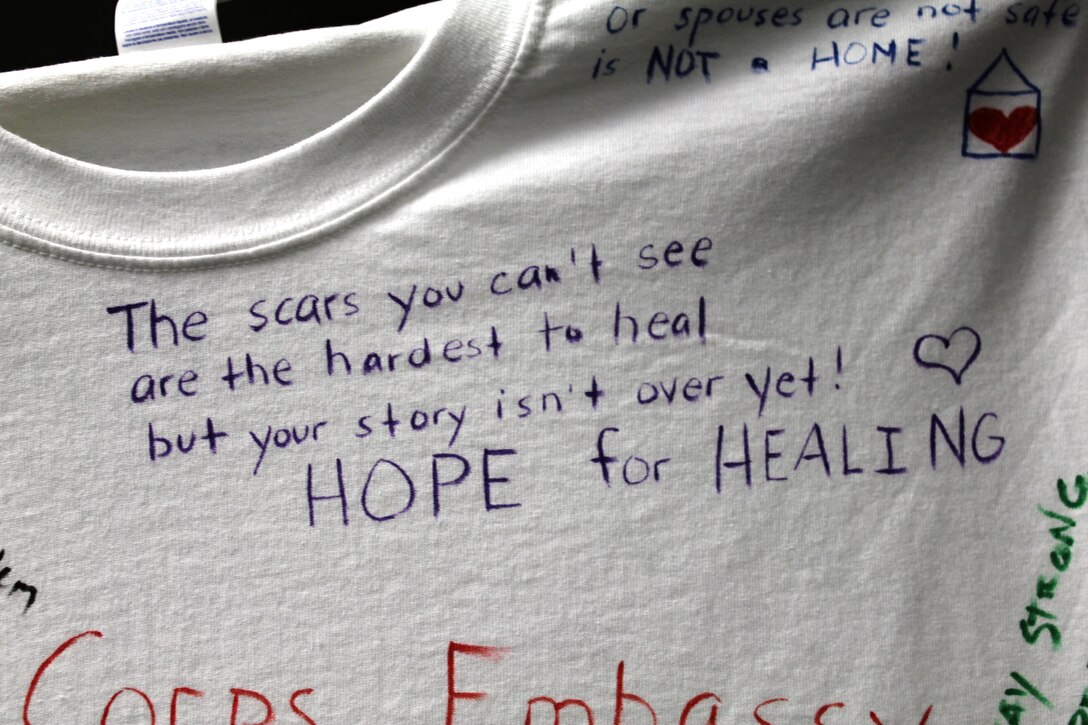 Messages written by Marines from Embassy Security Group on a shirt for the Clothesline Project, which addresses the issue of violence against women. The shirt was displayed with 15 others in the Family Advocacy Program's offices in Little Hall on Oct. 14.