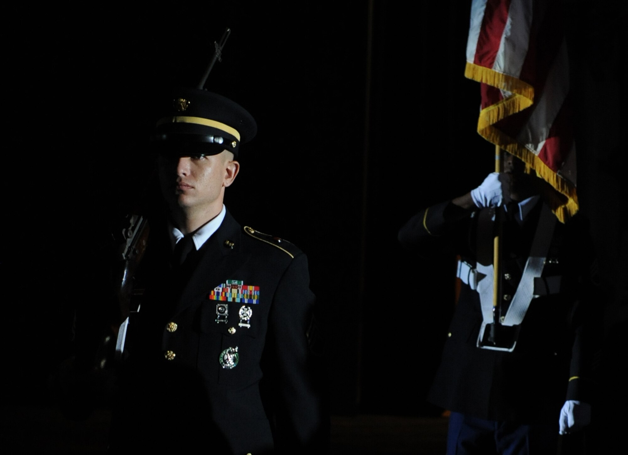 A color guard representing each branch of the military post the Colors during the 37th Annual Salute to the Military at the Mississippi Coast Convention Center, Oct. 20, 2015, Biloxi, Miss. The Salute to the Military recognizes the men and women who make up our military along the Gulf Coast.  (U.S. Air Force photo by Kemberly Groue)