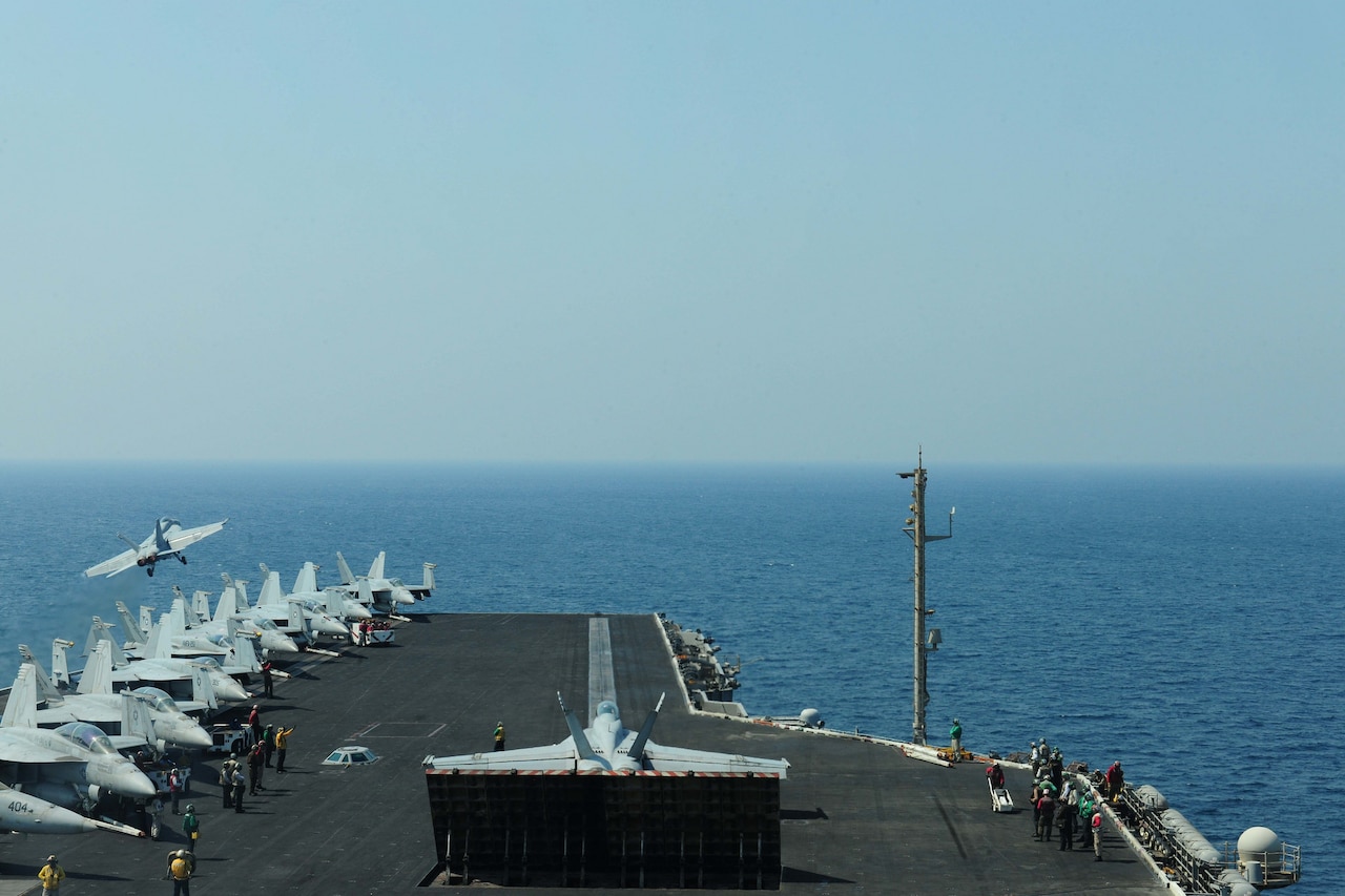 An F/A-18F Super Hornet, attached to the Red Rippers of Strike Fighter Squadron 11, prepares to launch off the flight deck aboard the aircraft carrier USS Theodore Roosevelt, Sept. 14, 2015. Theodore Roosevelt is deployed in the U.S. 5th Fleet area of operations supporting Operation Inherent Resolve strike operations in Iraq and Syria as directed while conducting maritime security operations and theater security cooperation efforts in the region. U.S. Navy photo by Petty Officer 3rd Class Stephane Belcher
