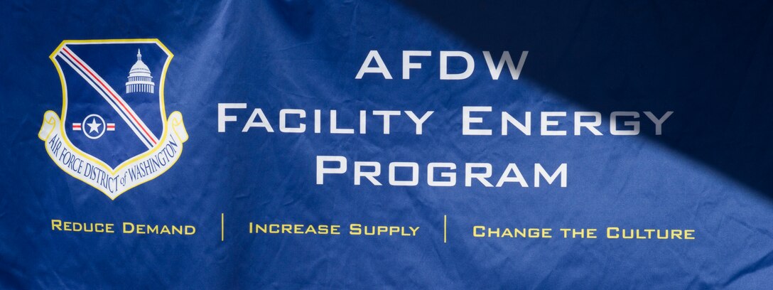 A sign is displayed over a table at the Energy Action Day booth, Oct. 21, 2015, at the Base Exchange on Joint Base Andrews, Md. The booth, as part of Energy Awareness Month, informed community members of cost saving tips on conserving energy and included a demonstration and resources on how to do so. (U.S. Air Force photo by Senior Airman Dylan Nuckolls/Released)