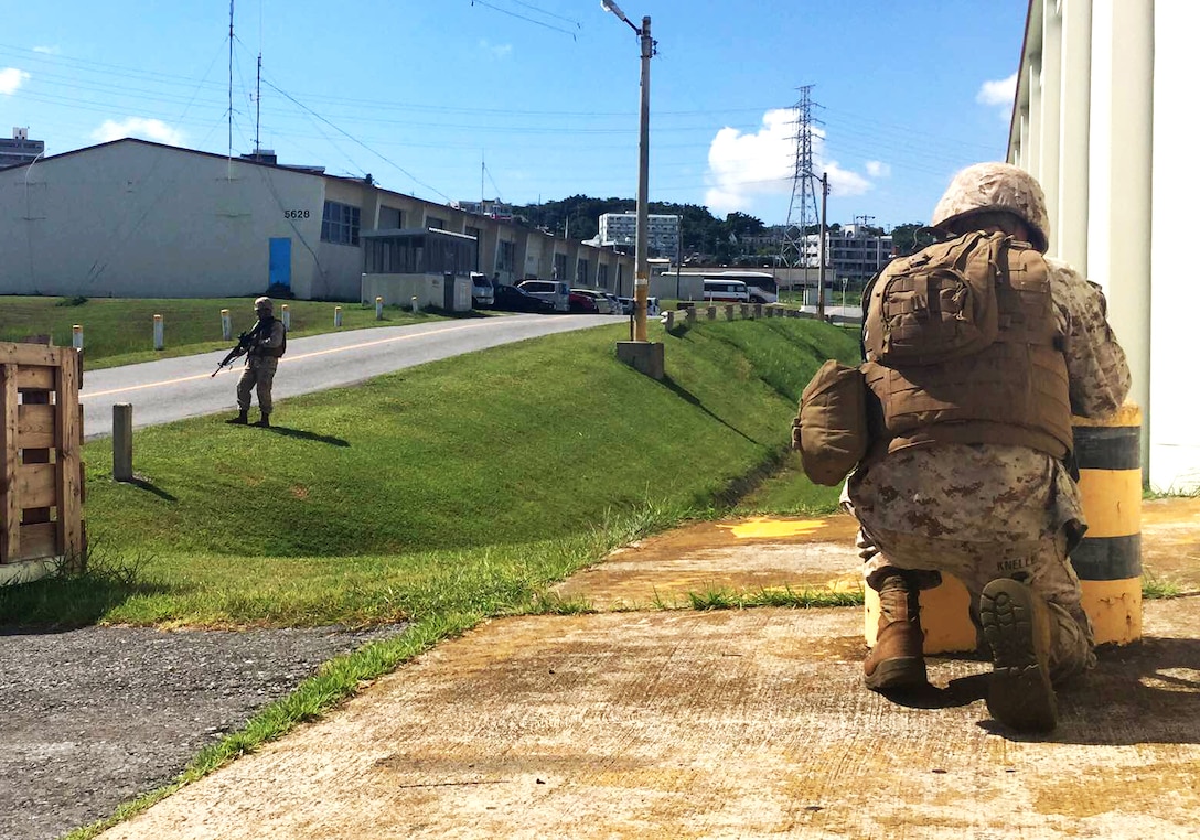 Lance Cpl. Tyler L. Knelle patrols during Exercise Constant Vigilance 2015 on Sept. 22 at Camp Foster, Okinawa, Japan. The SAF supports the Provost Marshal’s Office, Headquarters and Support Battalion, Marine Corps Installations Pacific-Marine Corps Base Camp Butler, Japan in security related operations during elevated force protection conditions and tropical cyclone conditions of readiness while also providing security at major events and exercises. Knelle is cyber network operator with G-6, communications, H&S BN, MCIPAC-MCB Camp Butler, Japan.