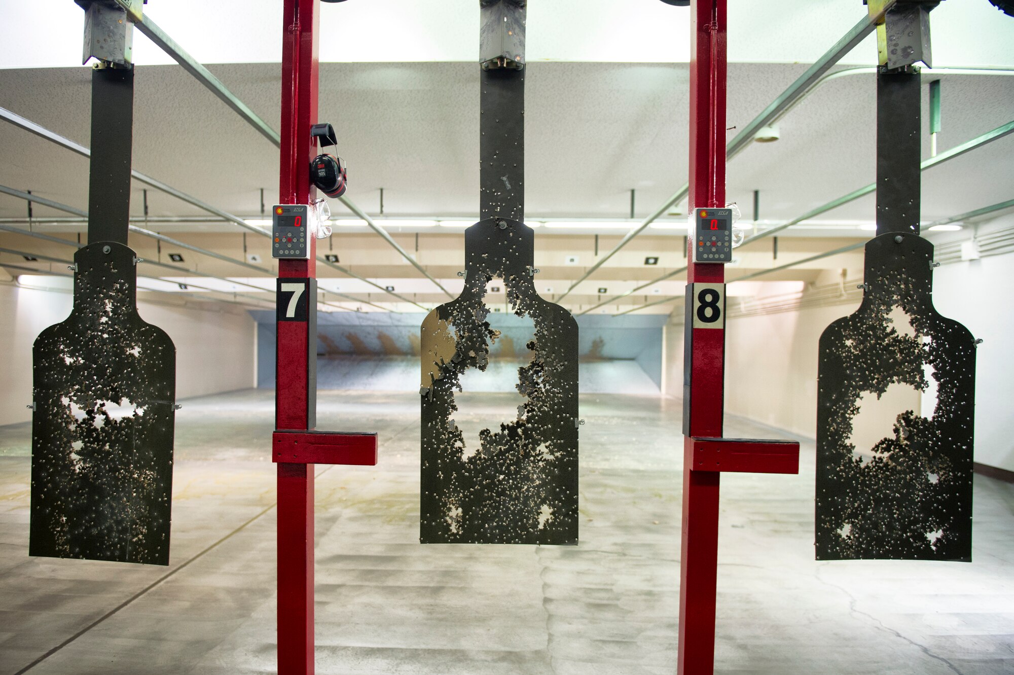 Targets hang after being shot during a combat arms training at Yokota Air Base, Japan, Oct. 8, 2015. In keeping with their combat readiness requirements, Airmen participate in the Combat Arms Training and Maintenance course to learn skills vital for defending themselves and their fellow Airmen downrange. (U.S. Air Force photo by Airman 1st Class Delano Scott/Released)
