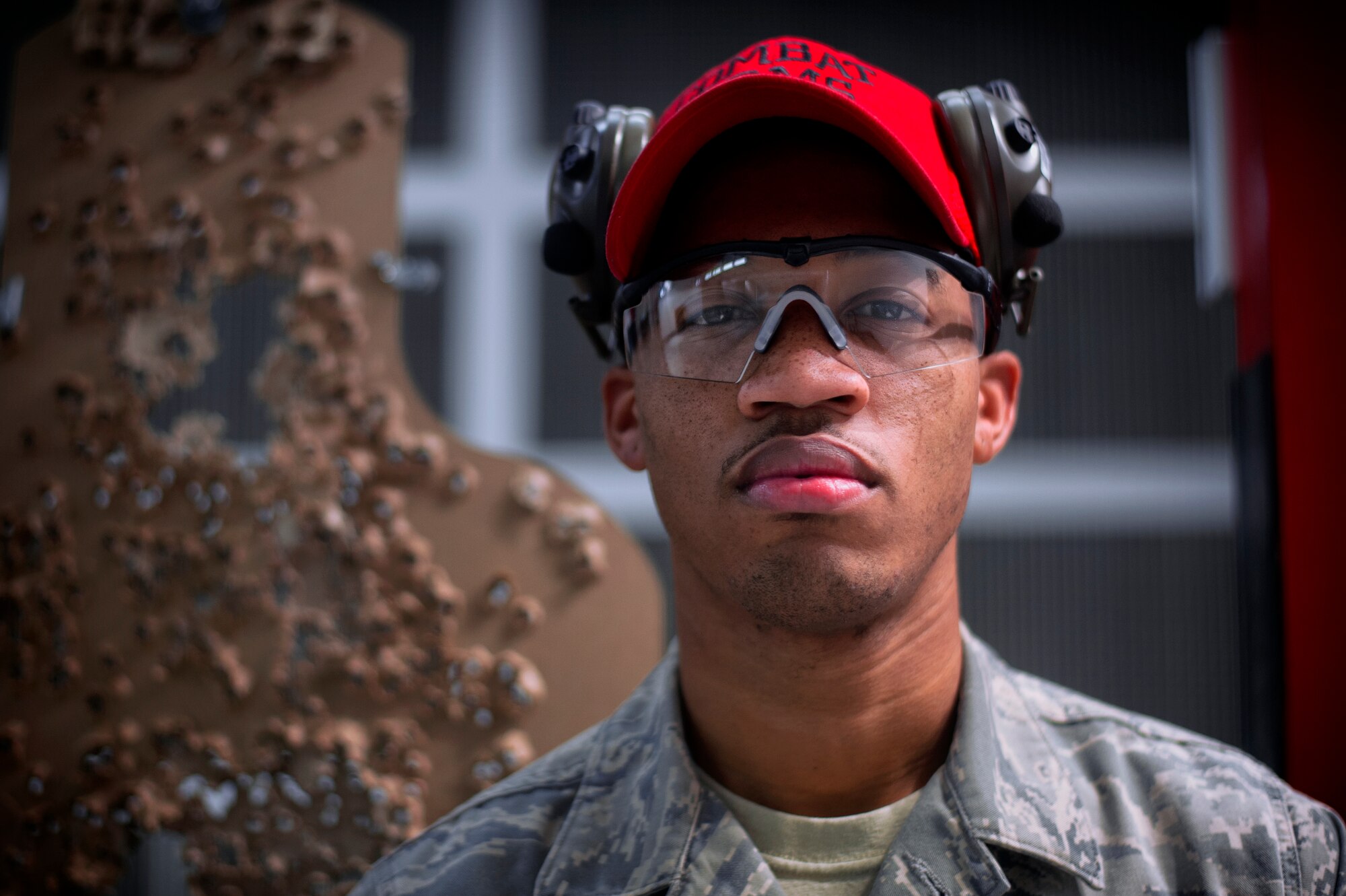 Senior Airman Carlton Dixon, 374th Security Forces Squadron combat arms instructor, poses for a photo at Yokota Air Base, Japan, Oct. 8, 2015. Combat arms training instructors provide ground weapons training and inspections for all Air Force personnel. (U.S. Air Force photo by Airman 1st Class Delano Scott/Released) 