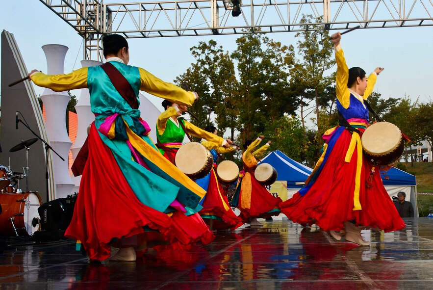 Korean women perform a traditional Korean drum routine called Ogomu during the 12th annual Korean American Friendship Festival in the Songtan Entertainment District, Republic of Korea, Oct. 17, 2015. Ogomu consists of dancers simultaneously beating various patterns and rhythms on drums in a synchronized fashion. The dance originates from Buddhist and Shaman rituals. (U.S. Air Force photo/Senior Airman Kristin High)