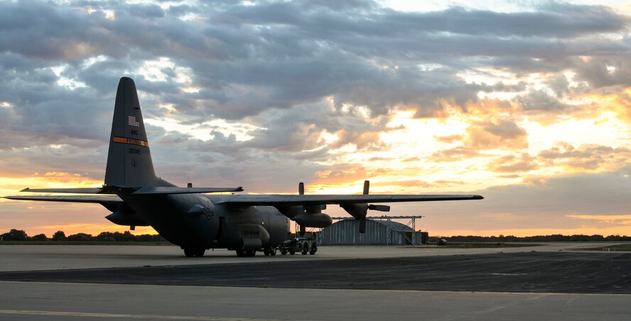 A C-130H Hercules aircraft assigned to the 182nd Airlift Wing, Illinois Air National Guard, is taxied off the installation’s apron at sunrise in Peoria, Ill., Oct. 15, 2015. The Hercules aircraft helps perform the tactical portion of the Air Force’s airlift mission. (U.S. Air National Guard photo by Staff Sgt. Lealan Buehrer/Released)
