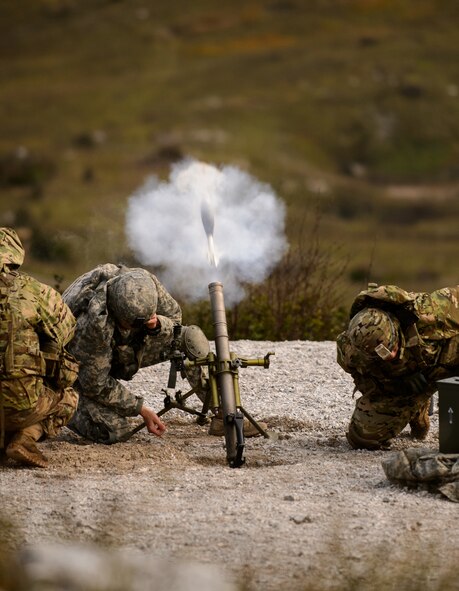 U.S. soldiers take cover after firing a mortar round Oct. 19, 2015, at Pocek Training Range, near Postojna, Slovenia. Mortarmen from the 2nd Battalion, 503rd Infantry Regiment supported exercise Rock Proof V with indirect fire as other assets provided close air support, artillery and machine gun fire. The exercise was designed to build interoperability between U.S. and Slovenian militaries and maintain strong ties between NATO allies. (U.S. Air Force photo/ Staff Sgt. Armando A. Schwier-Morales)