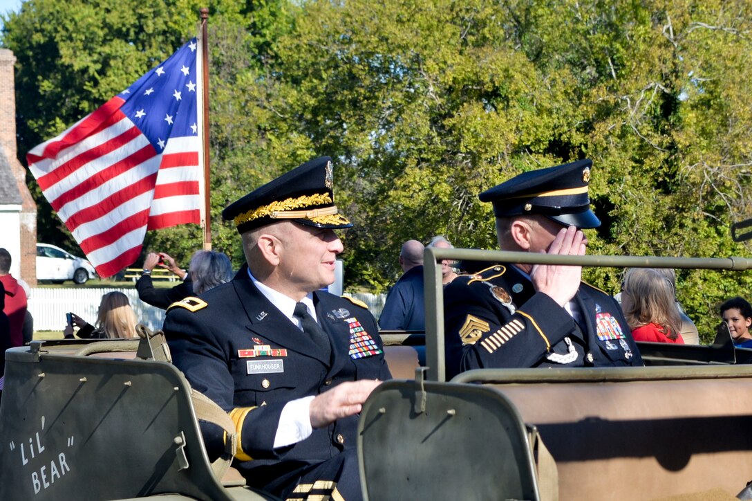 U.S. Army Maj. Gen. Anthony C. Funkhouser, Center for Initial Military Training commanding general, and Command Sgt. Maj. Dennis J. Woods, Initial Military Training command sergeant major, participate in the annual Yorktown Day parade in Yorktown, Va., Oct 19, 2015. Funkhouser served as the grand marshal for the parade to celebrate the 234th anniversary for America’s Revolutionary War victory at Yorktown. (U.S. Air Force photo by 2nd Lt. Mahalia R. Frost /Released)