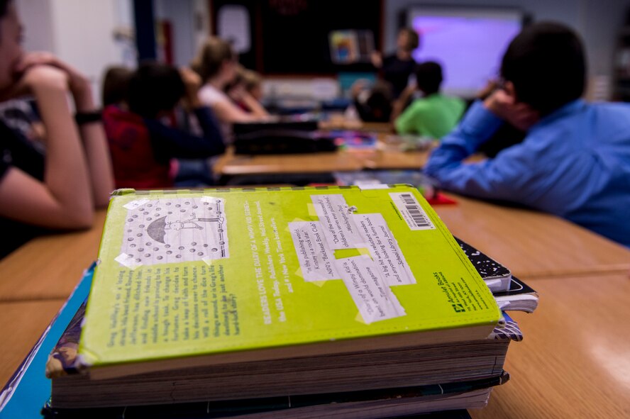 Books are displayed on a desk during a reading session for a Read Across the Globe event inside Spangdahlem Middle School Oct. 20, 2015, at Spangdahlem Air Base, Germany. The American Red Cross and Points of Light put on the event to break a Guinness World Record of the most kids read to in a 24-hour period, while also promoting literacy. (U.S. Air Force photo by Senior Airman Rusty Frank/Released)