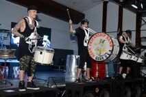 The punk rock percussion band Street Drum Corps performs for service members and their families Oct. 20, 2015, at Andersen Air Force Base, Guam. The band uses items such as trash bins, baseball bats and drum kits to create their rock inspired music. (U.S. Air Force photo by Airman 1st Class Arielle Vasquez/Released)