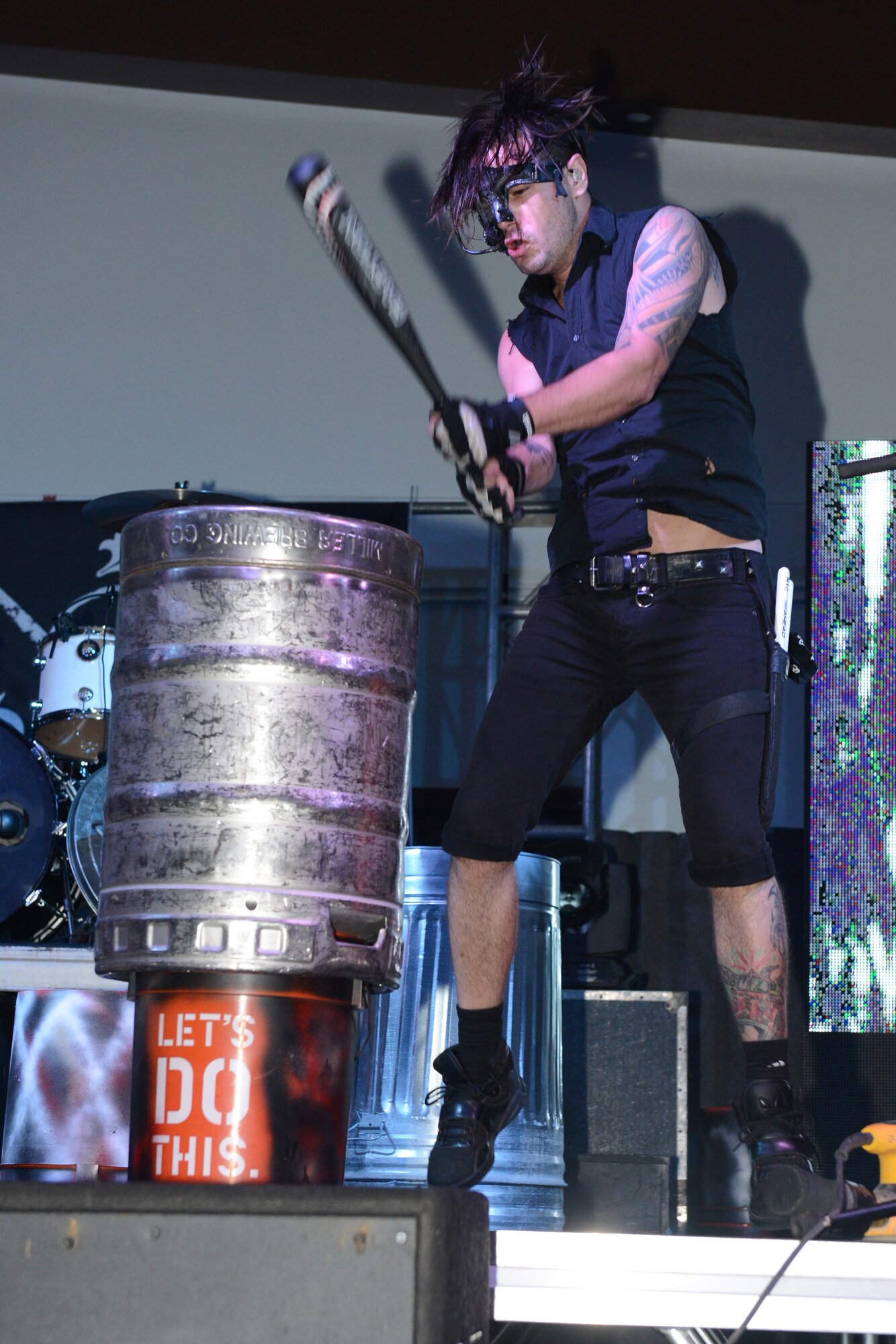 Adam Alt, member of the band Street Drum Corps, performs for service members and their families Oct. 20, 2015, at Andersen Air Force Base, Guam. The band uses items such as trash bins, baseball bats and drum kits to create their rock inspired music. (U.S. Air Force photo by Airman 1st Class Arielle Vasquez/Released)