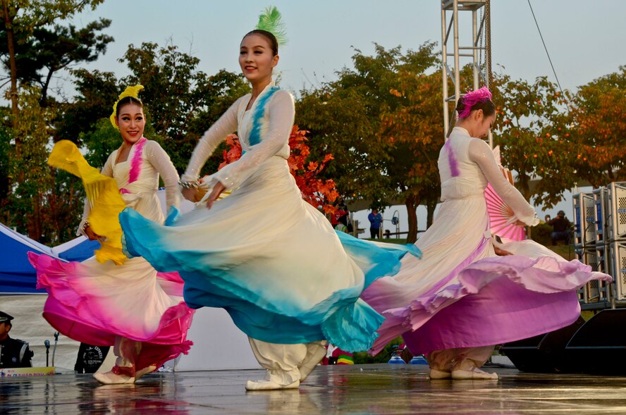Korean women perform a traditional dance during the 12th annual Korean American Friendship Festival in the Songtan Entertainment District, Republic of Korea, Oct. 17, 2015. Some Korean traditional dances were inspired by Shamanism, which influenced courtly music and dance, where traditional movements sought to reach a state of trance, such as hopping and stepping, walking back and forth in a circular pattern and rising on toes. (U.S. Air Force photo/Senior Airman Kristin High)