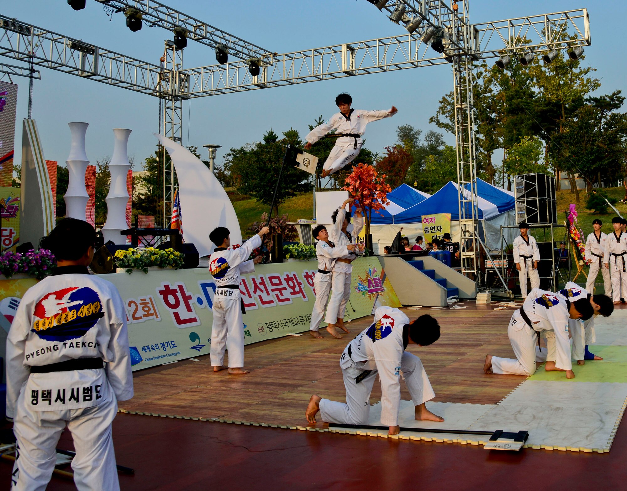 Taekwondo practitioners demonstrate martial arts skills during the 12th annual Korean American Friendship Festival in the Songtan Entertainment District, Republic of Korea, Oct. 17, 2015. The two-day event was hosted outside of Osan Air Base and featured American and Korean stage performers, martial arts demonstrations, cultural food and entertainment booths. (U.S. Air Force photo/Senior Airman Kristin High)