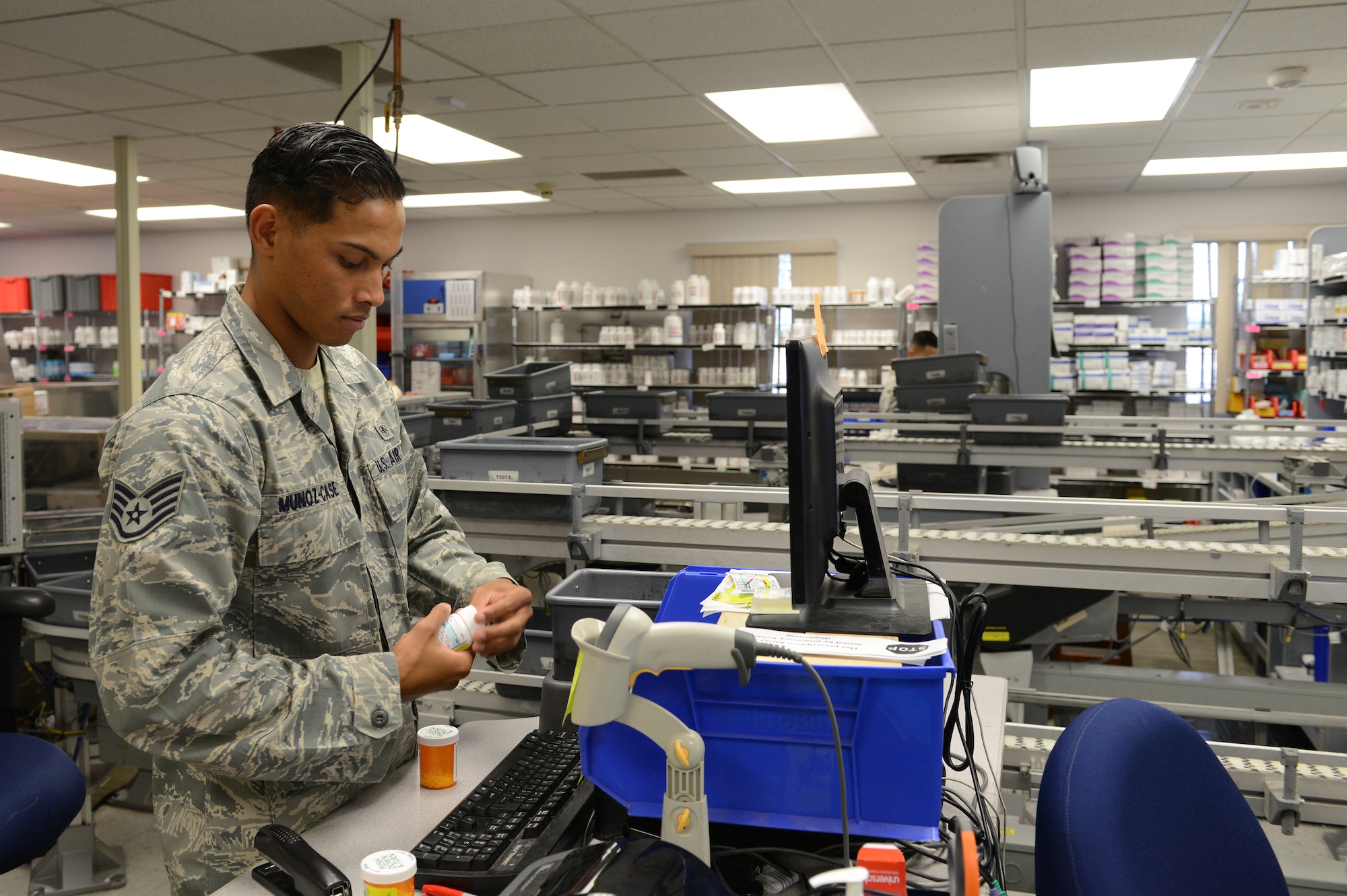 Staff Sgt. Aaron Munoz-Case, 56th Medical Support Squadron Arizona Refilling Center acting NCO in charge, checks prescriptions to ensure proper medication is packed at Luke Air Force Base, Arizona, Oct. 19, 2015. The ARC handles refilling prescriptions for all Tri Care Beneficiaries in the Phoenix and Scottsdale area. (U.S. Air Force photo by Senior Airman James Hensley)