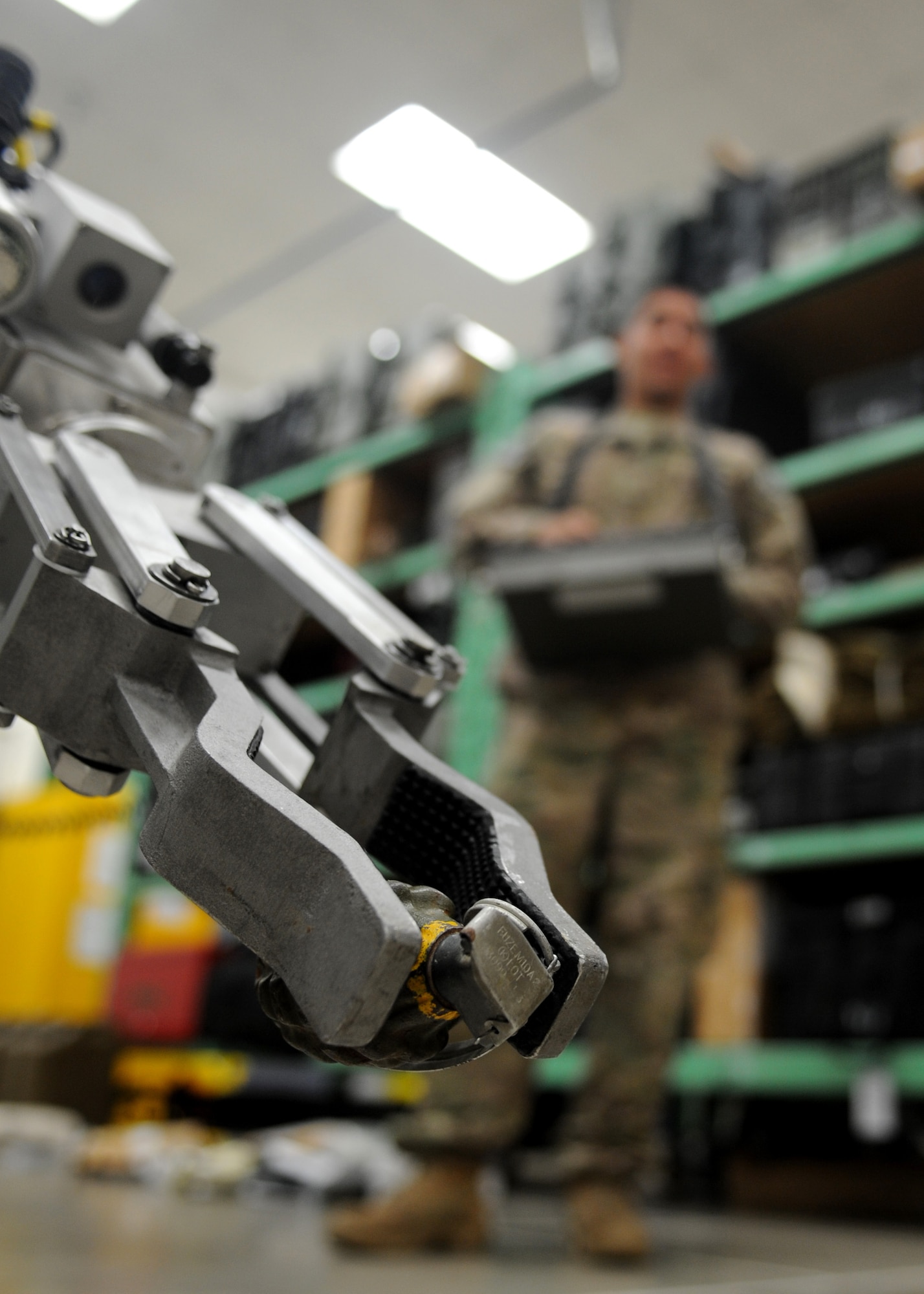 Airman 1st Class Andrew Perez, 28th Civil Engineer Squadron explosive ordnance disposal technician, uses an F-6 Alpha reconnaissance robot to pick up an inert fragmentation grenade at Ellsworth Air Force Base, S.D., Oct. 6, 2015. Depending on the length of the robot’s arm, it can carry up to 45 pounds and drag up to 150 pounds. (U.S. Air Force photo by Airman Sadie Colbert/Released)