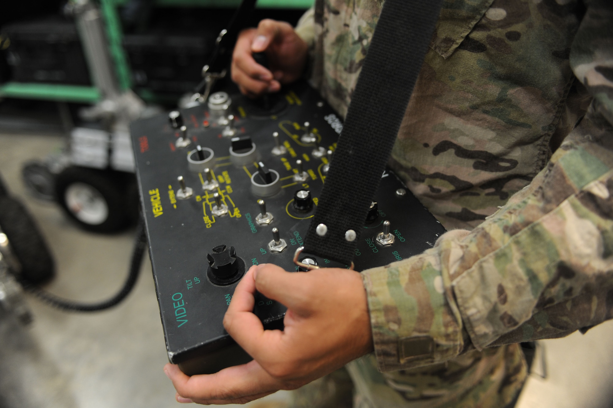 Airman 1st Class Andrew Perez, 28th Civil Engineer Squadron explosive ordnance disposal technician, uses a control panel to operate an F-6 Alpha reconnaissance robot at Ellsworth Air Force Base, S.D., Oct. 6, 2015. The robots are used to investigate any improvised explosive devices in an area before EOD personnel physically handle potential bombs. (U.S. Air Force photo by Airman Sadie Colbert/Released)