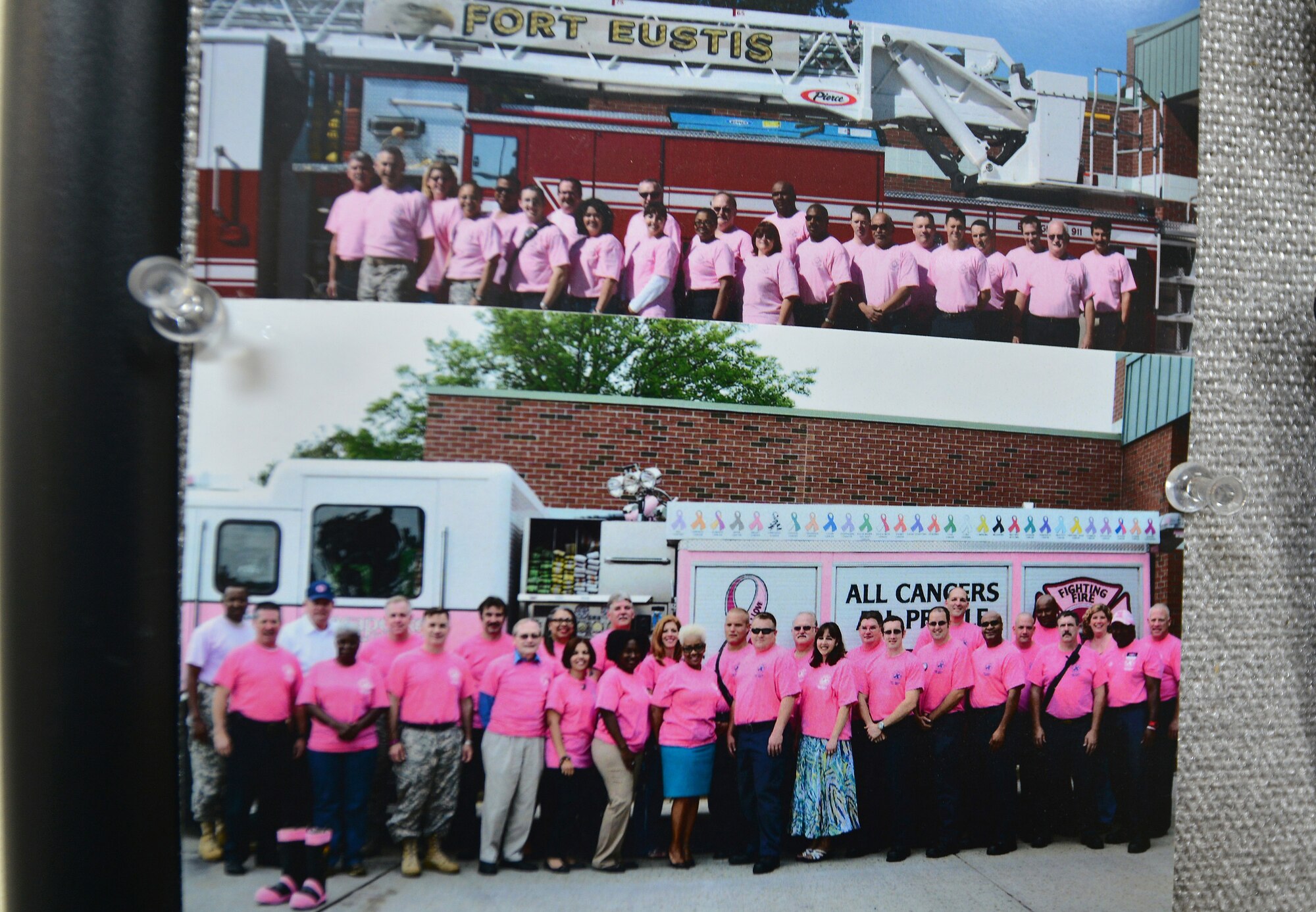 Donna Haynes, 733rd Civil Engineer Division environmental programs assistant, participates nearly every year in the Fort Eustis Fire Department’s annual Breast Cancer Awareness Month photo at Fort Eustis, Va. The fire department wears pink shirts throughout October to bring awareness to the month’s campaign. This year, the department wears the shirts in honor of Haynes, who was recently diagnosed with Stage 1 breast cancer. (U.S. Air Force photo by Staff Sgt. Natasha Stannard/Released)