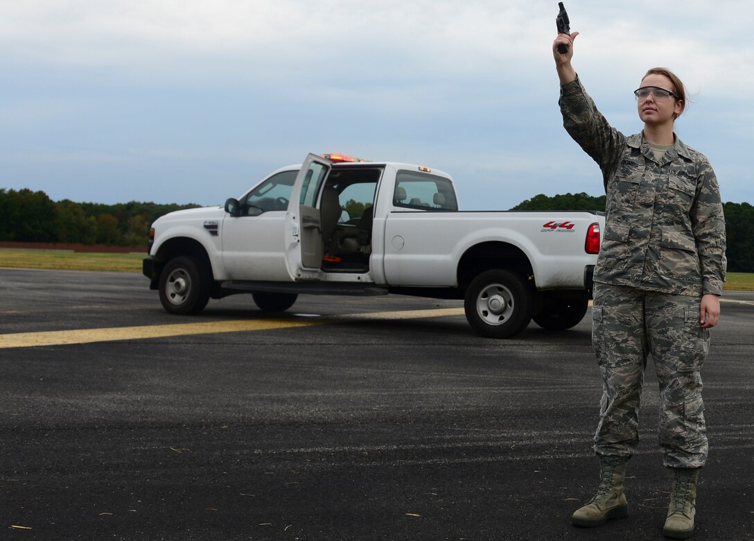 U.S. Air Force Airman 1st Class Alison Coombs, 1st Operations Support Squadron Airfield Management shift lead, prepares to fire the Bird Air Strike Hazard gun at Langley Air Force Base, Va., Oct. 16, 2015. The BASH gun is used to ensure birds do not pose a threat to aircraft. (U.S. Air Force photo by Airman 1st Class Derek Seifert/ Released)