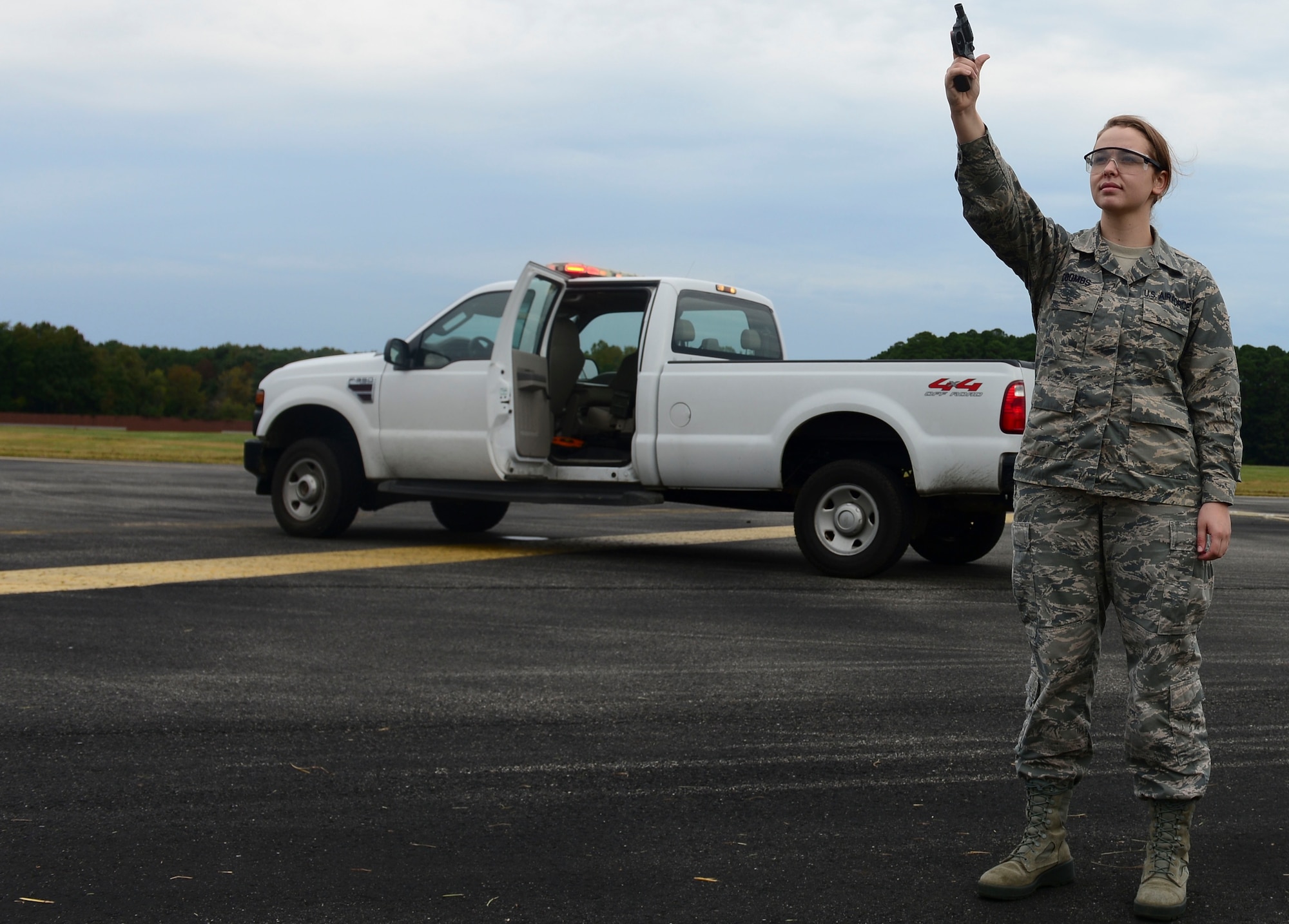 U.S. Air Force Airman 1st Class Alison Coombs, 1st Operations Support Squadron Airfield Management shift lead, prepares to fire the Bird Air Strike Hazard gun at Langley Air Force Base, Va., Oct. 16, 2015. The BASH gun is used to ensure birds do not pose a threat to aircraft. (U.S. Air Force photo by Airman 1st Class Derek Seifert/ Released)