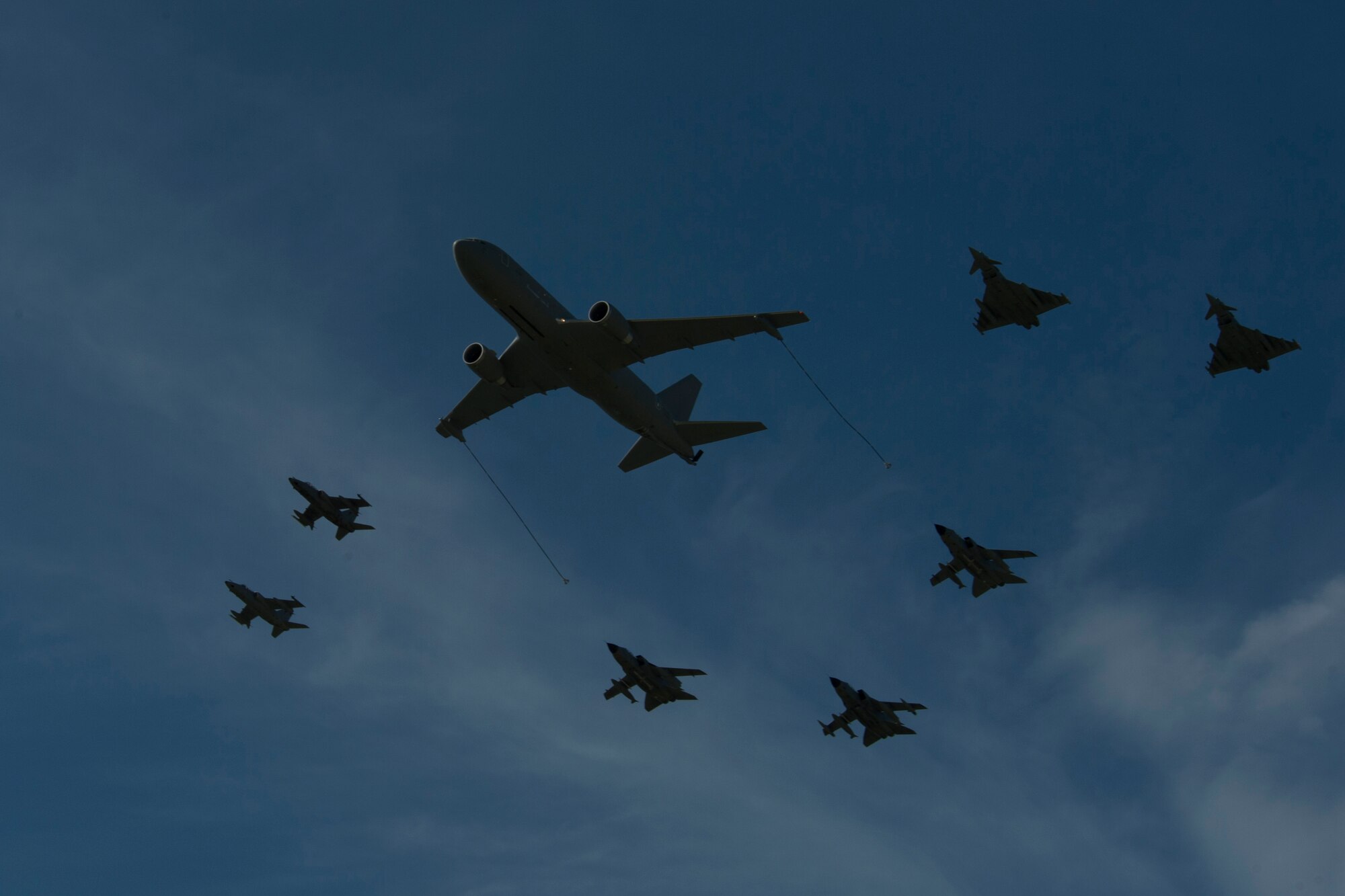 TRAPANI AIR BASE, Italy - Aircraft from multiple nations fly in formation during the Trapani Air Show at Trapani Air Base, Italy, Oct. 19, 2015. The Trapani Air Show kicked off Trident Juncture 2015, a training exercise involving more than 30 Allied and Partner Nations taking place throughout Italy, Portugal, Spain, the Atlantic Ocean, the Mediterranean Sea, Canada, Norway, Germany, Belgium and the Netherlands. (U.S. Air Force photo by Airman 1st Class Luke Kitterman/Released)
