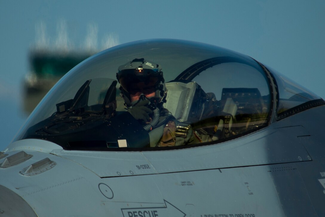 An F-16 Fighting Falcon fighter aircraft pilot, assigned to 480th Fighter Squadron at Spangdahlem Air Base, Germany, taxis an F-16 during the Trapani Air Show at Trapani Air Base, Italy, Oct. 19, 2015. The Trapani Air Show kicked off Trident Juncture 2015, a training exercise involving more than 30 Allied and Partner Nations taking place throughout Italy, Portugal, Spain, the Atlantic Ocean, the Mediterranean Sea, Canada, Norway, Germany, Belgium and the Netherlands. (U.S. Air Force photo by Airman 1st Class Luke Kitterman/Released
