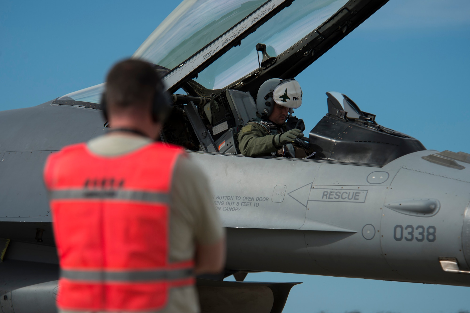BEJA AIR BASE, Portugal - An F-16 Fighting Falcon fighter aircraft pilot from the 480th Fighter Squadron, Spangdahlem Air Base, Germany, conducts pre-flight checks before take off at Beja Air Base, Portugal, Oct. 21, 2015. The 480th FS is here in support of Exercise Trident Juncture 2015, a multinational exercise consisting of more than 30,000  troops from more than 30 nations. The exercise is geared toward demonstrating ability to respond on a large scale to a crisis scenario. (U.S. Air Force photo by Airman 1st Class Luke Kitterman/Released)