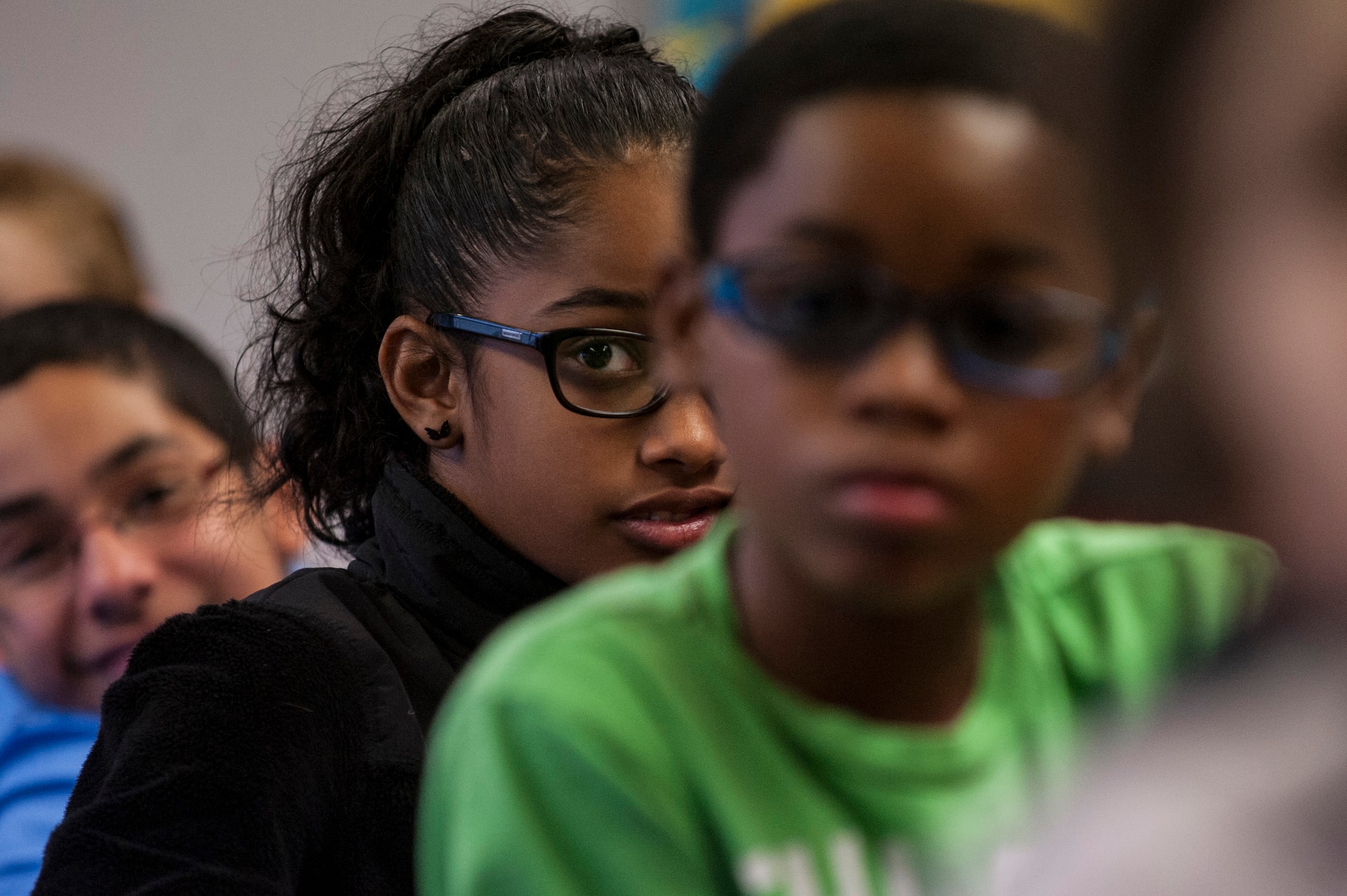 Spangdahlem Middle School students listen during a reading session for a Read Across the Globe event Oct. 20, 2015, at Spangdahlem Air Base, Germany. More than 50 volunteers read the book Farmer Will Allen and the Growing Table, to children throughout a 24-hour period. (U.S. Air Force photo by Senior Airman Rusty Frank/Released)