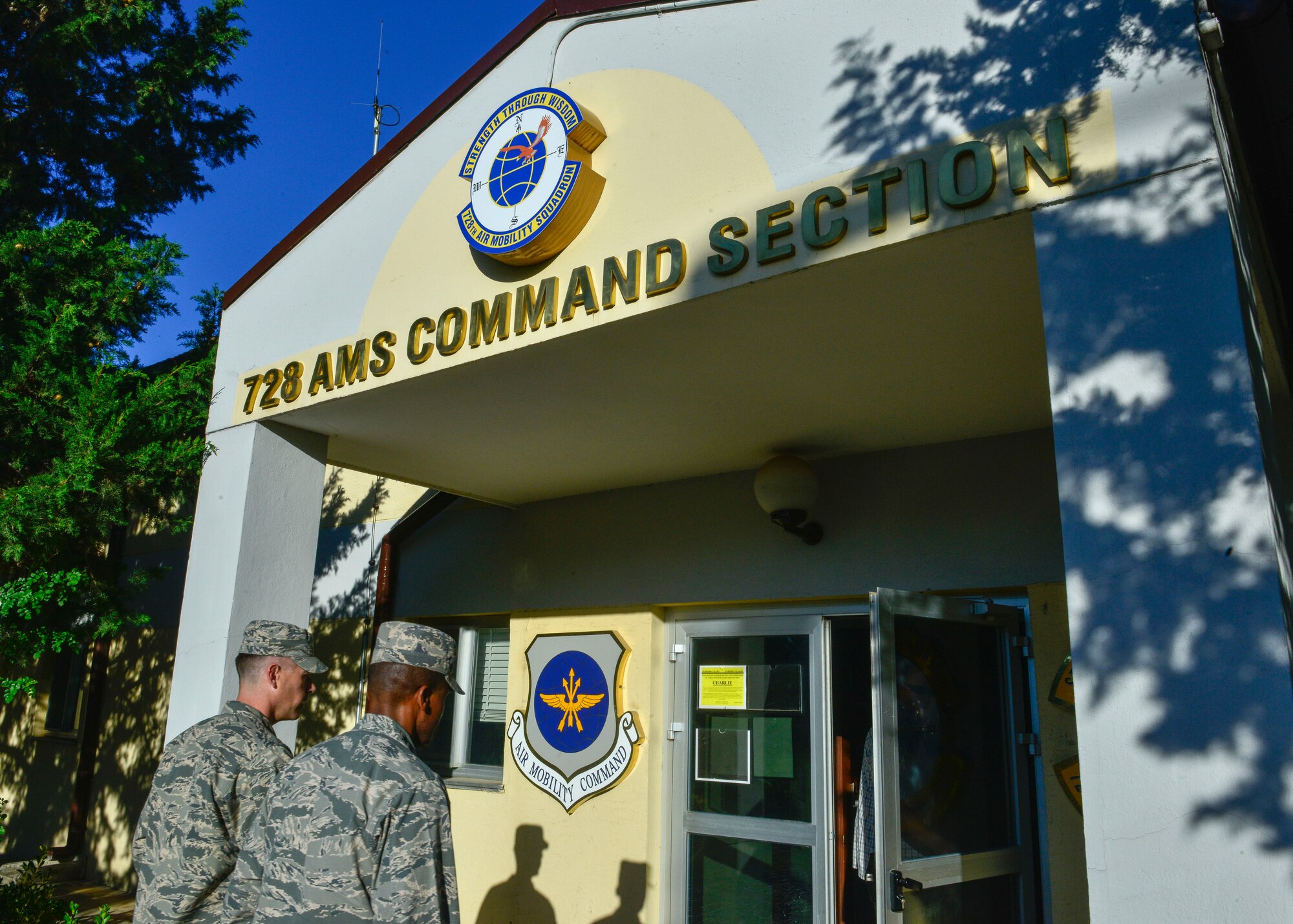 Lt. Col. George Buch, 728th Air Mobility Squadron commander and Gen. Darren McDew, U.S. Transportation Command commander, visit the 728th AMS squadron Oct. 17, 2015, at Incirlik Air Force Base, Turkey. Airmen from the 728th AMS briefed McDew on current operations and services provided to Airmen and their families stationed at Incirlik. (U.S. Air Force photo by Airman 1st Class Cory W. Bush/Released)