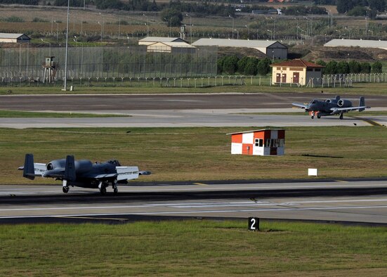 Two A-10C Thunderbolt II attack aircraft taxi down the flight line after landing at Incirlik Air Base, Turkey, Oct. 15, 2015. The aircraft are deployed to Turkey in support of the Coalition effort against ISIL and Operation Inherent Resolve. (U.S. Air Force photo by Airman 1st Class Daniel Lile/Released)