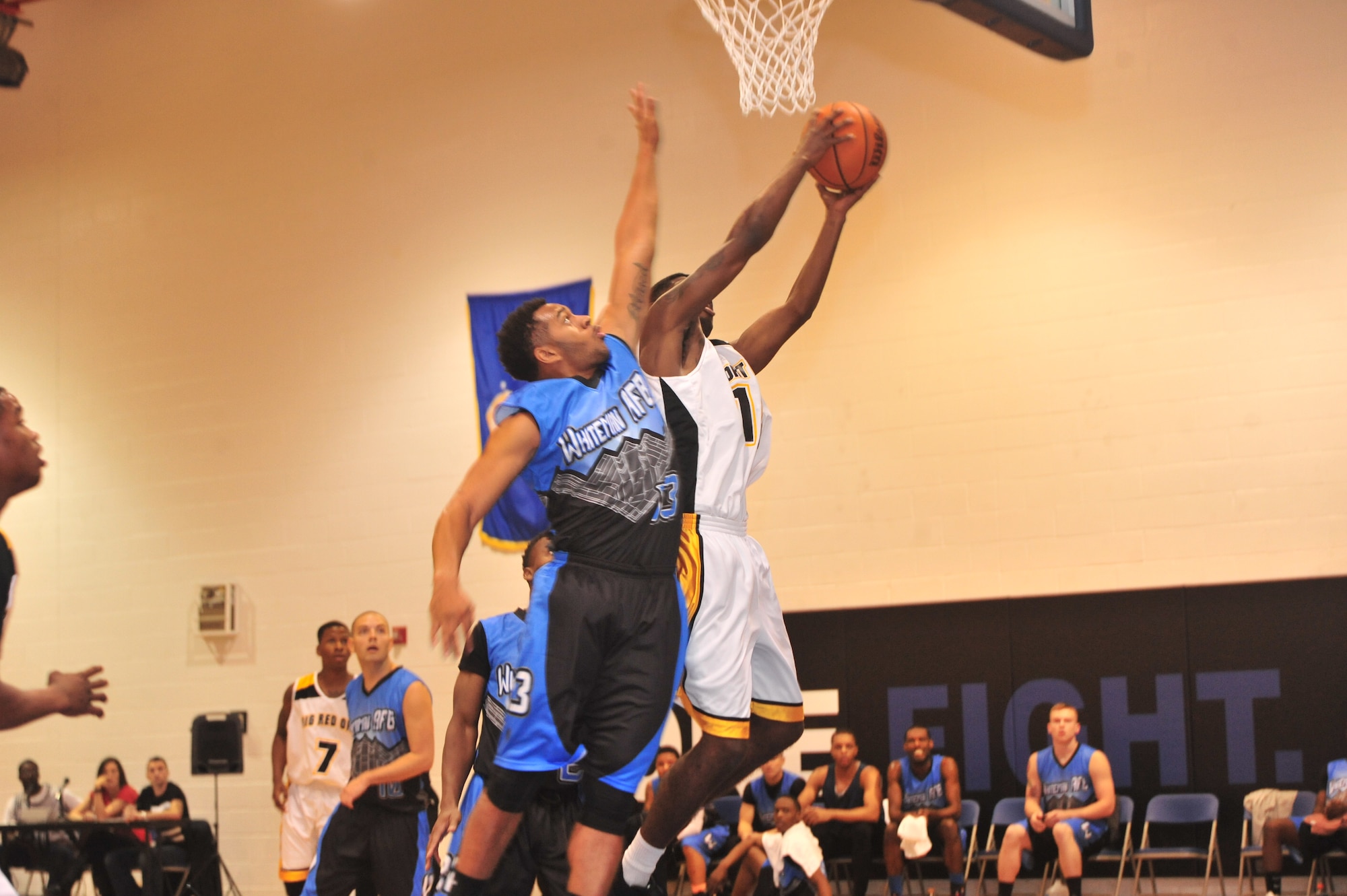U.S. Air Force Senior Airman Isaac Moore, 509th Maintenance Group, attempts to block a layup during the Whiteman Varsity basketball game at Whiteman Air Force Base, Mo., Oct. 10, 2015. Whiteman played their first of four games against the varsity team of Ft. Riley, KS.   U.S. Air Force photo by Airman 1st Class Jovan Banks/released 