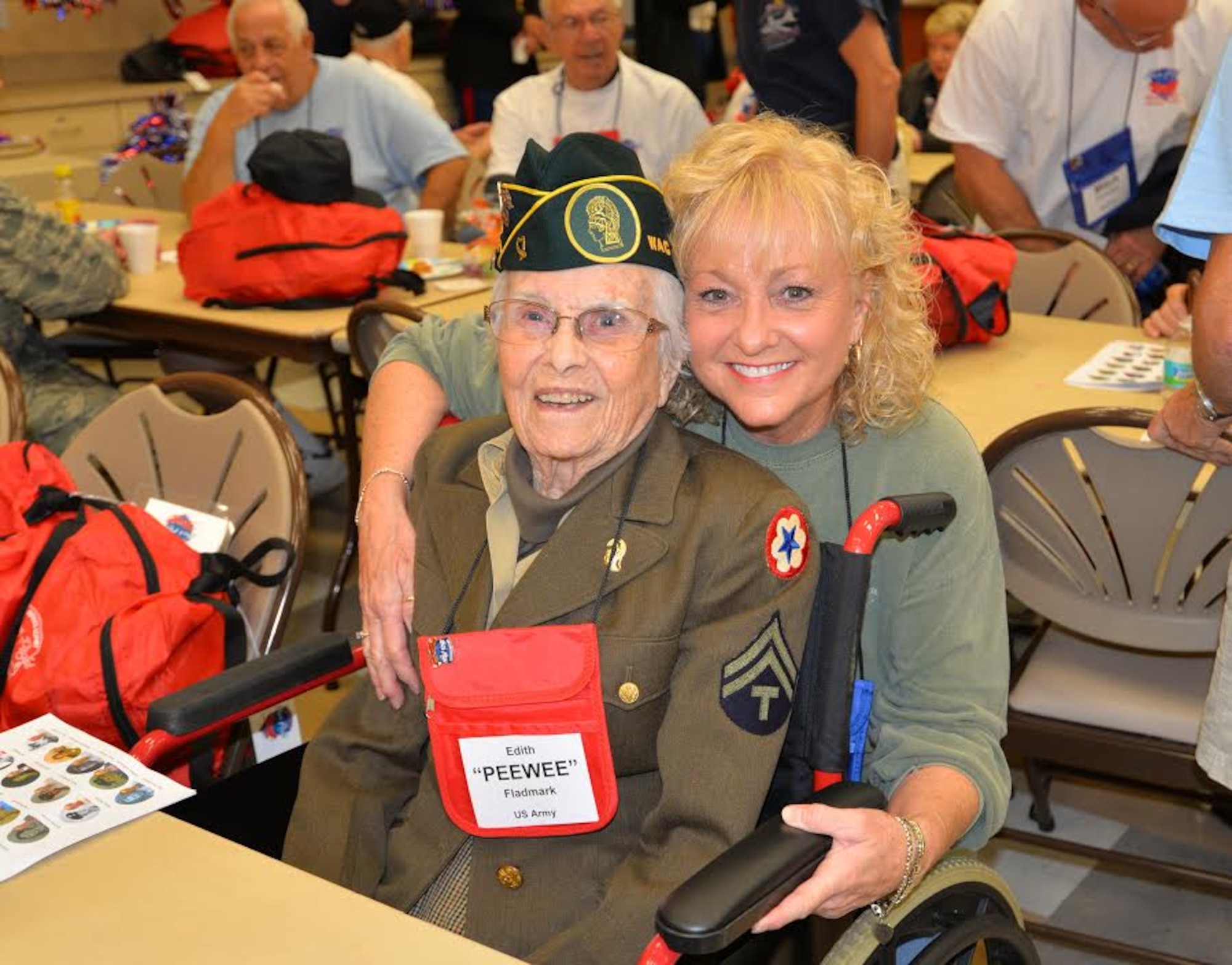 Edith “Pewee” Fladmark, a World War II U.S. Army veteran, poses with her guardian Janis Buffaloe during an Honor Flight send-off event Oct. 17, 2015, at the Wickham Senior Center in Melbourne, Fla. Space Coast Honor Flight is an organization that provides World War II, Korean and Vietnam War Veterans an opportunity to visit their war memorials on a one-day trip to Washington, D.C. (U.S. Air Force photo by 1st Lt. Alicia Premo/Released) 