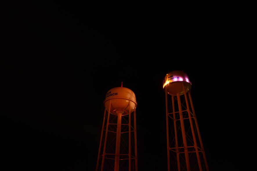 Purple lights illuminate one of two water towers on Laughlin Air Force Base, Texas, Oct. 21, 2015. The outcome of “Purple Light Nights” each year during October’s Domestic Violence Awareness Month is to increase the awareness of domestic violence issues and it’s affect upon children and families and to further impress upon the mission to “Remember, the victims who lost their lives from domestic violence; Support those who survived domestic violence; and Hope for those still living with abuse.” (U.S. Air Force photo by Tech. Sgt. Steven R. Doty)(Released)