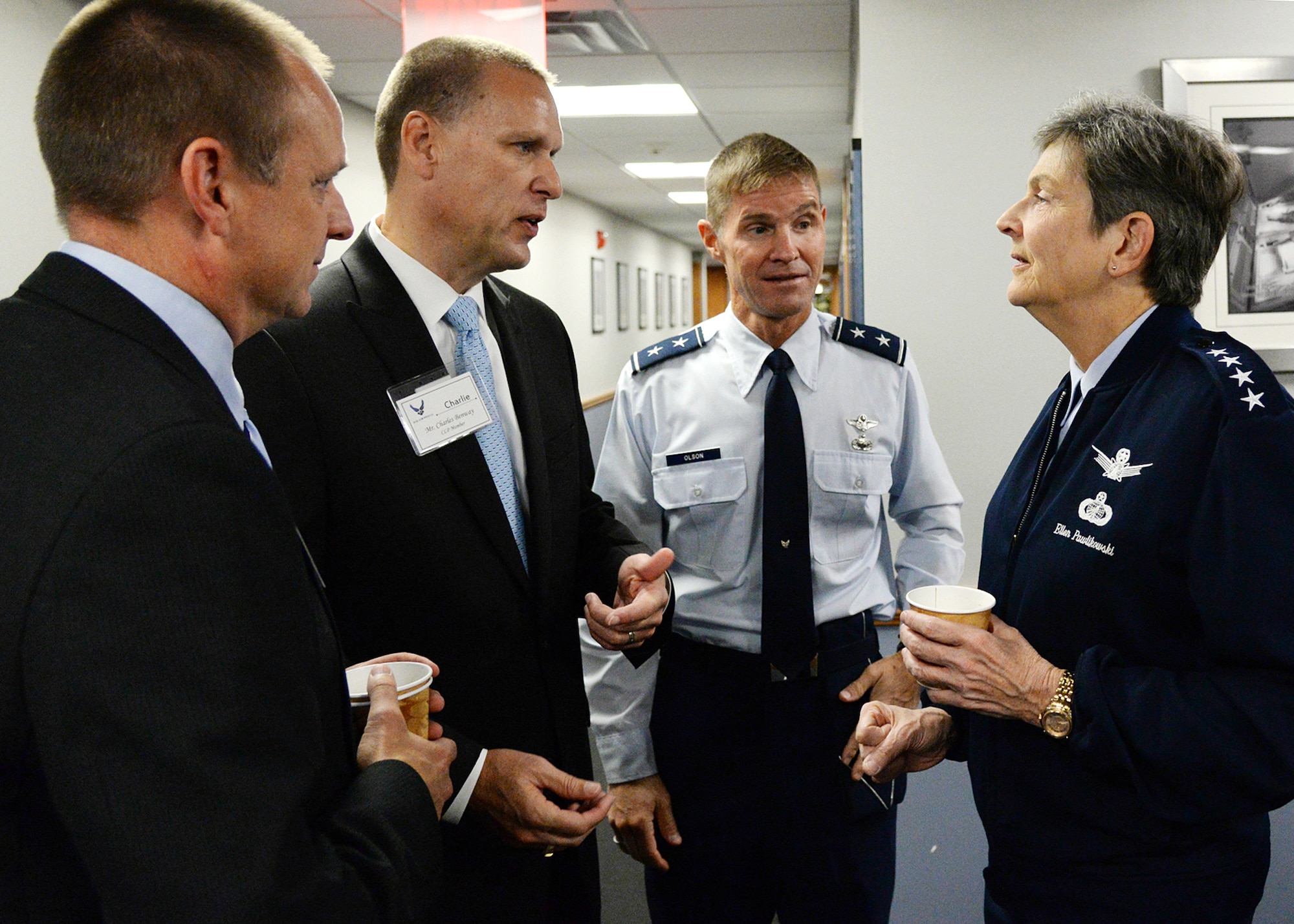 Gen. Ellen M. Pawlikowski, commander of Air Force Materiel Command, chats with Chris Willenborg, left, executive director of the Mass. Military Task Force; Charlie Benway, executive director of the Advanced Cyber Security Center; and C3I&N Program Executive Officer Maj. Gen. Craig Olson during a breakfast meeting at Hanscom AFB Oct. 21. Pawlikowski also toured and received briefings from major Hanscom organizations, MITRE and MIT Lincoln Laboratory during her two-day visit. (U.S. Air Force photo by Linda LaBonte Britt)
