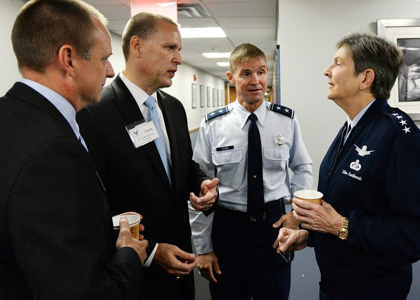 Gen. Ellen M. Pawlikowski, commander of Air Force Materiel Command, chats with Chris Willenborg, left, executive director of the Mass. Military Task Force; Charlie Benway, executive director of the Advanced Cyber Security Center; and C3I&N Program Executive Officer Maj. Gen. Craig Olson during a breakfast meeting at Hanscom AFB Oct. 21. Pawlikowski also toured and received briefings from major Hanscom organizations, MITRE and MIT Lincoln Laboratory during her two-day visit. (U.S. Air Force photo by Linda LaBonte Britt)
