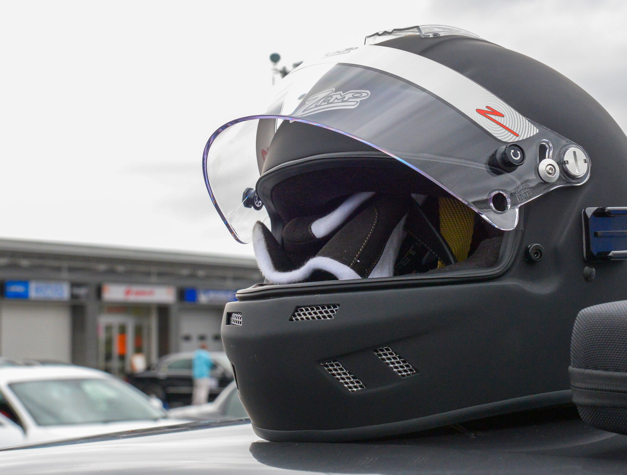 A helmet is prepared for use at Fuji Speedway, Japan, Oct. 17, 2015. The Air Force requires Airmen to wear safety equipment during high risks activities like high-speed racing. The equipment includes a jump suit and authorized helmet. (U.S. Air Force photo by Airman 1st Class Elizabeth Baker/Released)