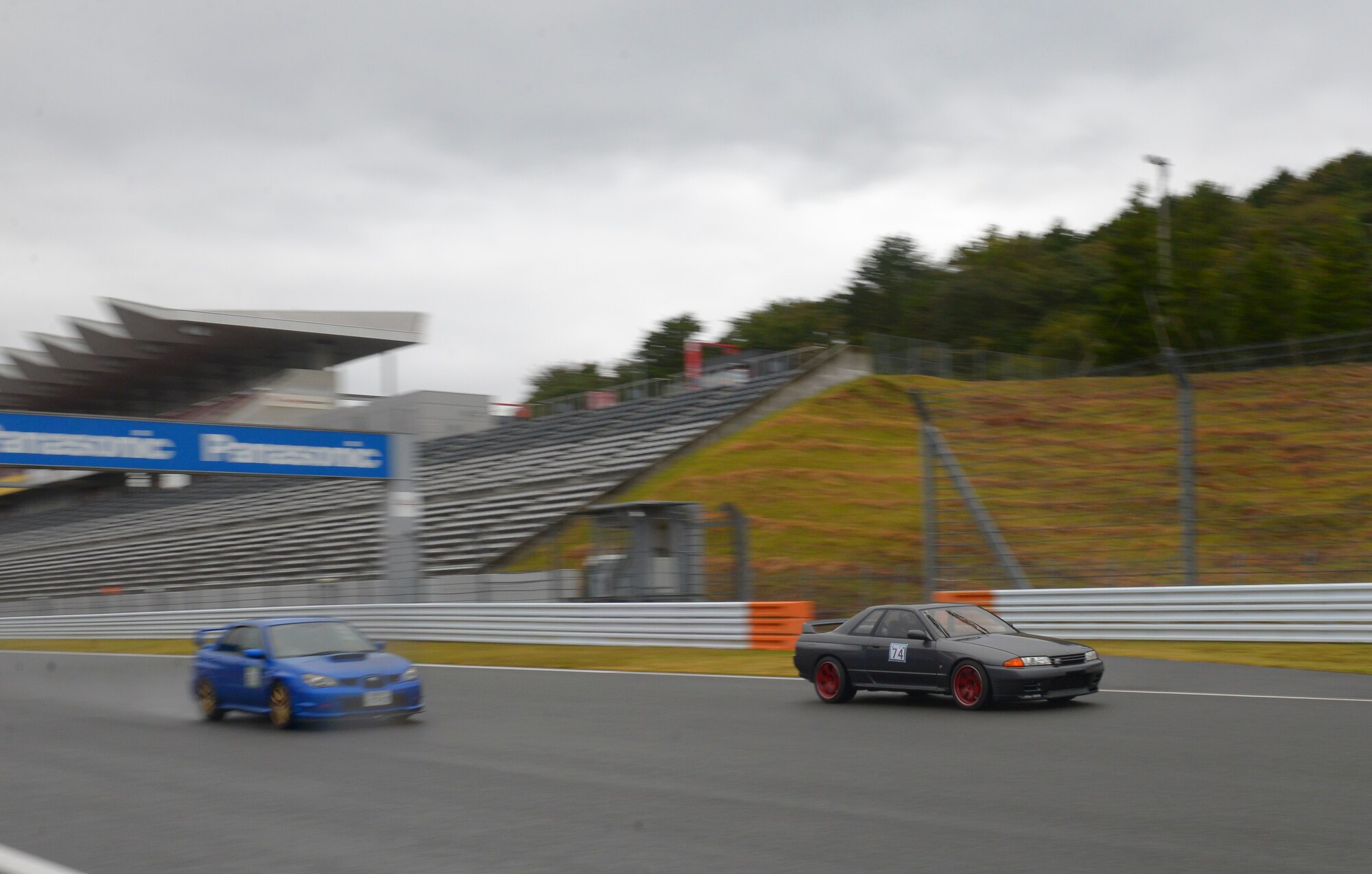 Senior Airman Thomas Kirts, 374th Civil Engineer Squadron driver operator, competes at Fuji Speedway, Japan, Oct. 17, 2015. Kirts participated in two 30-minute heats, which were casual races for the enjoyment of the competitors. (U.S. Air Force photo by Airman 1st Class Elizabeth Baker/Released) 