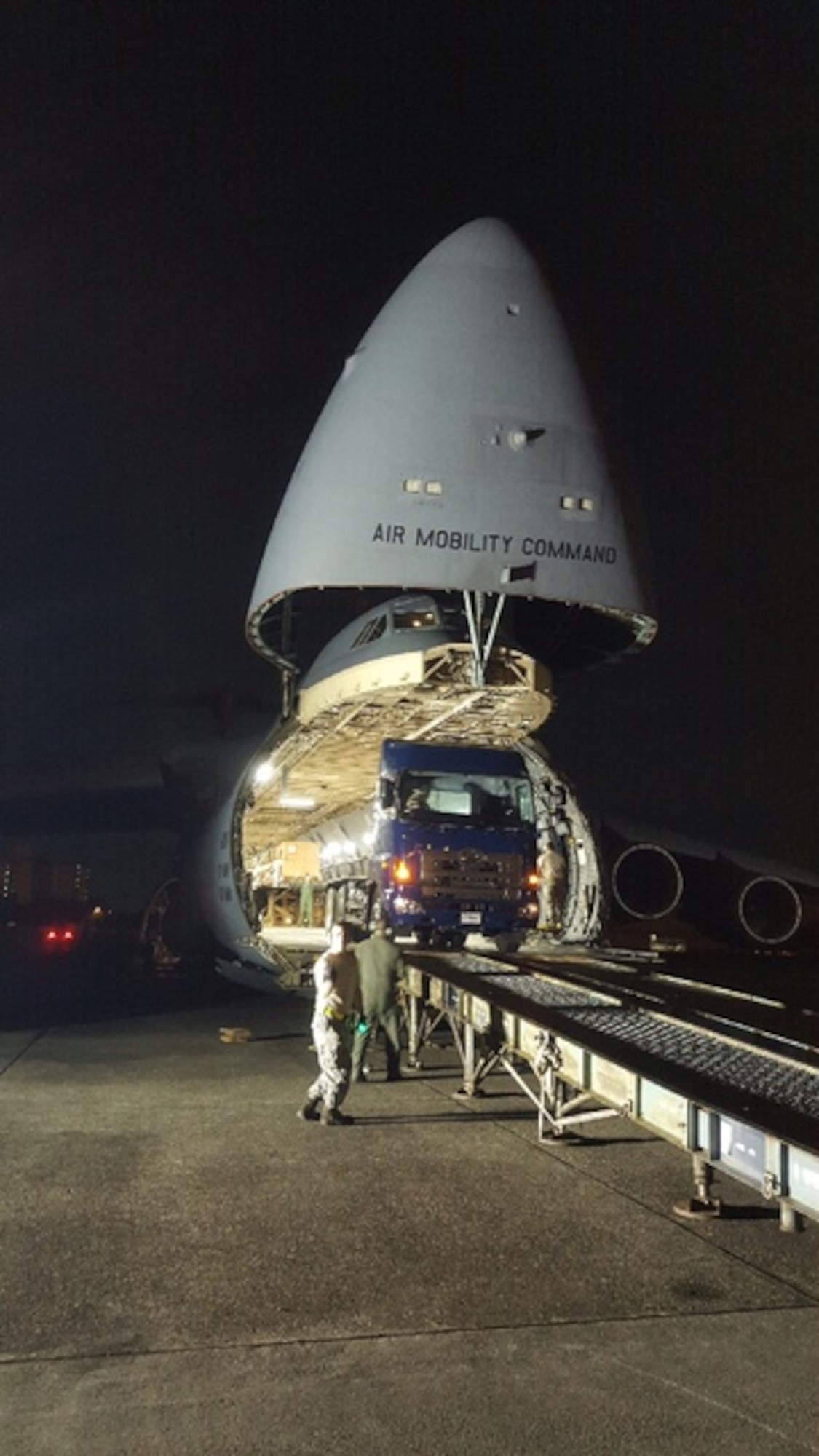 Members with the 730th Air Mobility Squadron load stern shafts onto a C-5 Galaxy at Yokota Air Base, Japan, Aug. 23, 2015. (Courtesy Photo)