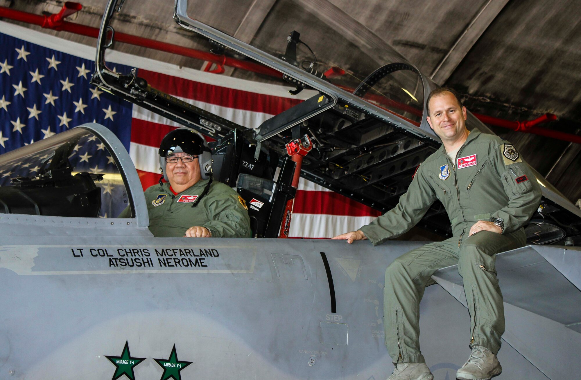 Atushi Nerome, 67th Fighter Squadron honorary commander, and U.S. Air Force Lt. Col. Chris McFarland 67th FS commander, sit on top of an F-15 Eagle Oct. 21, 2015, on Kadena Air Base, Japan. Nerome observed a Designated Crew Chief Ceremony to congratulate the Airmen who have been recognized as maintenance experts for their respective aircraft. The honorary commander was presented with a flight suit and his name displayed on an F-15 Eagle as a token of appreciation for his support of the 67th FS mission. (Courtesy photo) 