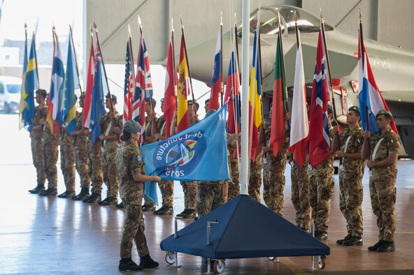 Opening Ceremony of Exercise Trident Juncture at Trapani Air Base, Italy. Rising of the Trident Juncture 2015 flag. More than 5,000 U.S. service members will participate in NATO’s Trident Juncture 2015 exercise conducted in Spain, Portugal and Italy, Belgium, Canada, Germany, The Netherlands, Norway and at sea, in the Atlantic Ocean and Mediterranean Sea. Trident Juncture is the largest NATO LIVEX to be conducted in the past 20 years, and serves as an annual NATO Response Force (NRF) certification exercise for 2016.  The U.S. Army, Air Force, Navy and Marine Corps and Special Operations personnel supporting the exercise will arrive from European and CONUS locations, to include some Army and Air National Guard assets. Special Operations Command Europe (SOCEUR), will be certified during this exercise and assume the role as the Special Operations Component Command for the NRF in 2016. Exercise Trident Juncture runs until Nov. 6, 2015.
