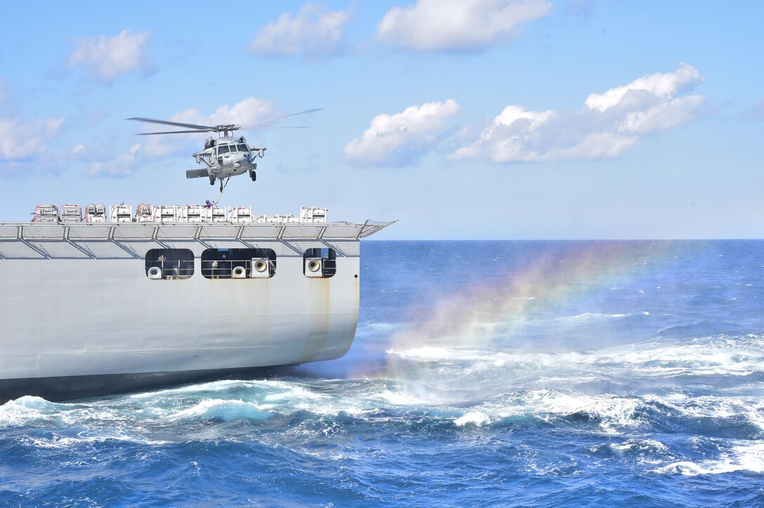 An MH-60S Seahawk helicopter picks up ordnance during an ammunition replenishment for the aircraft carrier USS Dwight D. Eisenhower from the dry cargo and ammunition ship USNS Robert E. Peary in the Atlantic Ocean, Oct. 13, 2015. The Seahawk is assigned to Helicopter Sea Combat Squadron 9. U.S. Navy photo by Petty Officer 3rd Class Wesley J. Breedlove