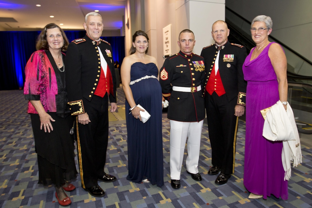 Debbie Paxton, left, with her husband Assistant Commandant of the Marine Corps Gen. John M. Paxton, second left,, Commandant of the Marine Corps, Gen. Robert B. Neller, second right, with his wife, D'Arcy Neller, right, pose with Staff Sgt. Joseph P. Bednarik and his wife during the 2015 USO Gala in Washington, D.C., Oct. 20, 2015. Bednarik was recognized as the USO Marine of the year during the gala. U.S. Marine Corps photo by Sgt. Gabriela Garcia