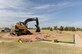 ALTUS AIR FORCE BASE, Okla. – A member of the 97th Civil Engineer Squadron pavement and heavy equipment shop pulls up concrete from the playground at Excellence Park Oct. 19. The playground is being rebuilt with newer equipment to improve safety for the families on Altus Air Force Base. (U.S. Air Force photo by Senior Airman Dillon Davis/Released)