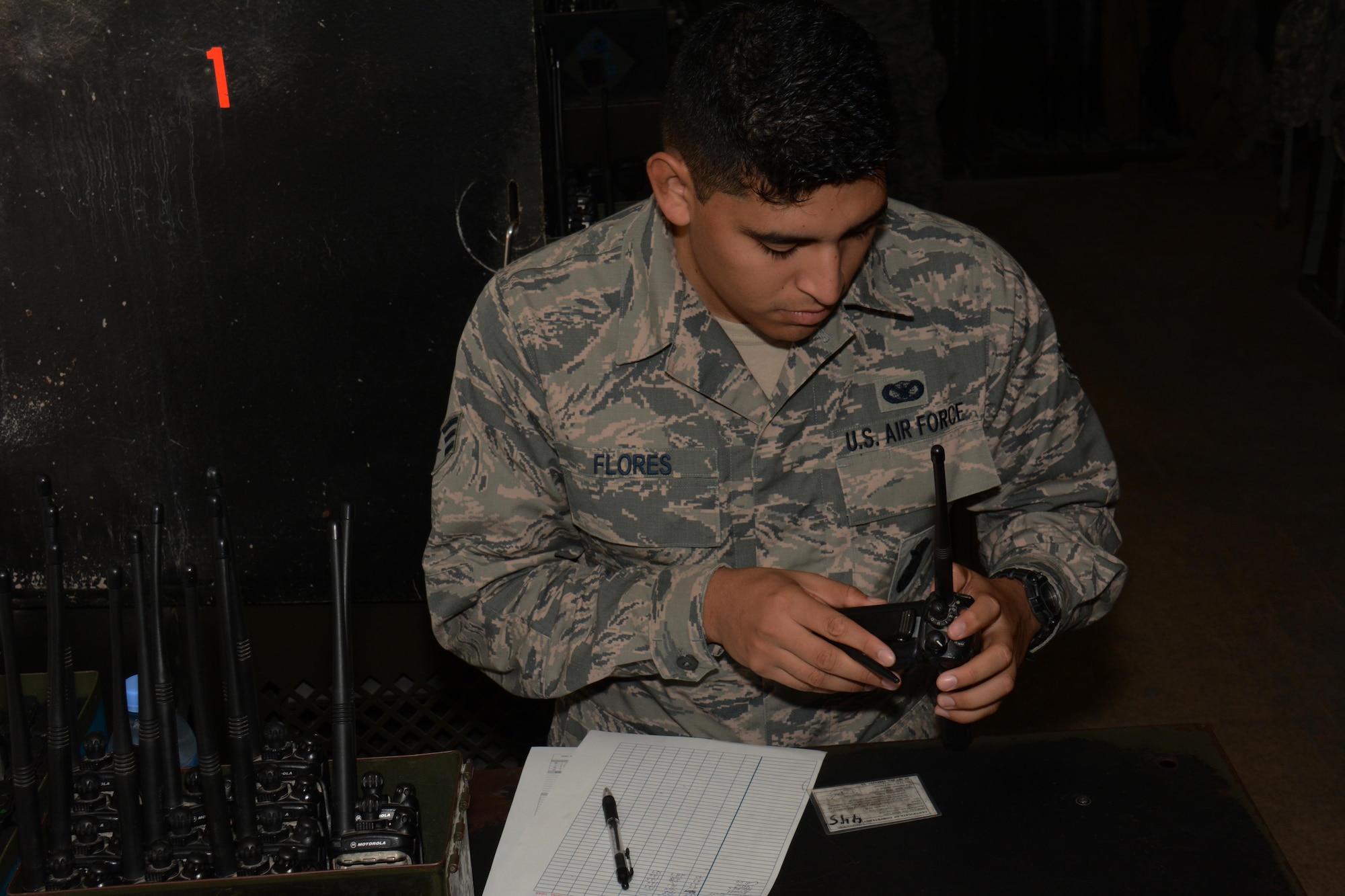 Senior Airman Eduardo Flores, 379th Security Forces Squadron, puts a radio together inside the 379th SFS armory at Al Udeid Air Base, Qatar Oct. 22. The armory maintains more than $5 million in weapons and equipment. (U.S. Air Force photo/Tech. Sgt. James Hodgman)