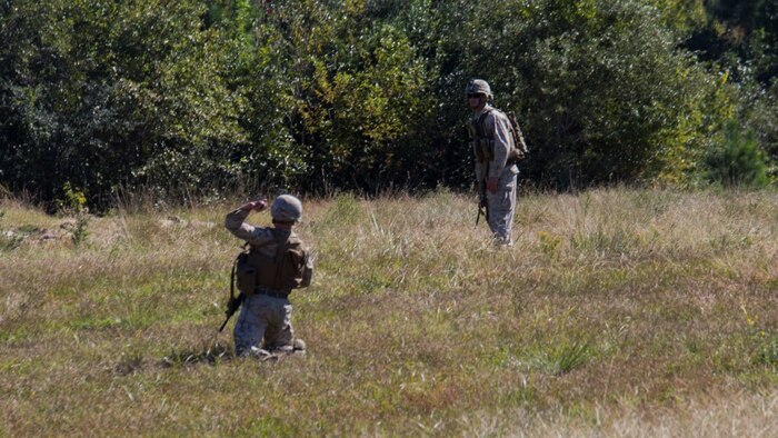 A Marine with 3rd Battalion, 6th Marine Regiment throws a simulated grenade during lane training at Marine Corps Base Camp Lejeune, N.C., Oct. 20, 2015. Marines with the company were required to assault a bunker and when within range, throw a grenade to eliminate any possible threats. The training consisted of four stations, each of which would provide instructions and hands-on training in radio communications, grenade employment, patrolling and emplacing M18 Claymores.