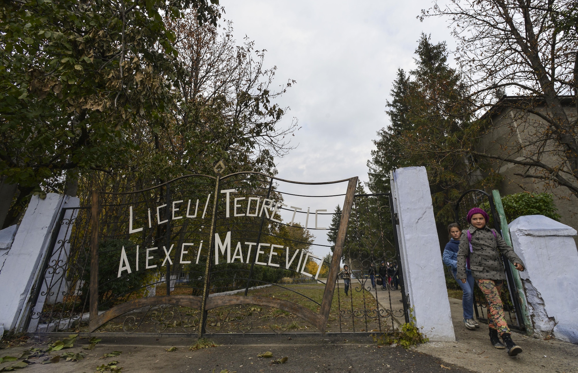 Moldovan students leave Liceul Teoretic Alexei Mateevici School for the day Oct. 19, 2015, in Sanatauca, Moldova. At least seven Airmen from the 435th Construction and Training Squadron and the 52nd Civil Engineer Squadron have been working on renovations to a gymnasium locker room at the school since Sept. 23. The Moldova Humanitarian and Civic Assistance program is part of a military and civilian theater security cooperation program the U.S. European Command uses to directly impact civilian communities throughout 17 countries, primarily in Eastern Europe. (U.S. Air Force photo/Senior Airman Nicole Sikorski)