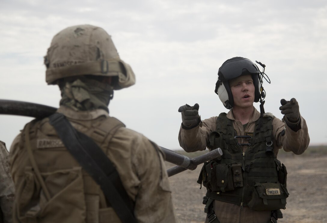 U.S. Marine Corps 1st. Lt. William Frazier, right, briefs Marines in preparation for a sling-load operation during an assault support tactics exercise at Landing Zone Bull, Chocolate Mountain Aerial Gunnery Range, Calif., Oct. 12, 2015. Frazier is an assistant aircraft maintenance officer. U.S. Marine Corps photo by Cpl. Summer Dowding    