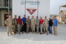U.S. Army Engineering and Support Center, Huntsville leadership recently conducted a site visit to Afghanistan to meet with Huntsville Center employees deployed there supporting a variety of missions to include Task Force Power, a multi-disciplined effort focusing on electrical inspections and fire safety awareness; Afghan-Wide Mine and Battle Area Clearance, which removes landmine and unexploded ordnance throughout the country; and environmental remediation and environmental footprint reduction programs set in place to leave a safer, cleaner environment once American presence is removed from Afghanistan. From left are Fred Cartes, Huntsville Center Deputy Commander Lt. Col. Burlin Emery, Tony Isadore, Mike Fields, Huntsville Center Commander Col. Robert Ruch, Kirk Baumann, Ken Barnett, Karen Moore, Plyer McManus, Nate Fisher and Bruce Railey. Gail Overman is not pictured.