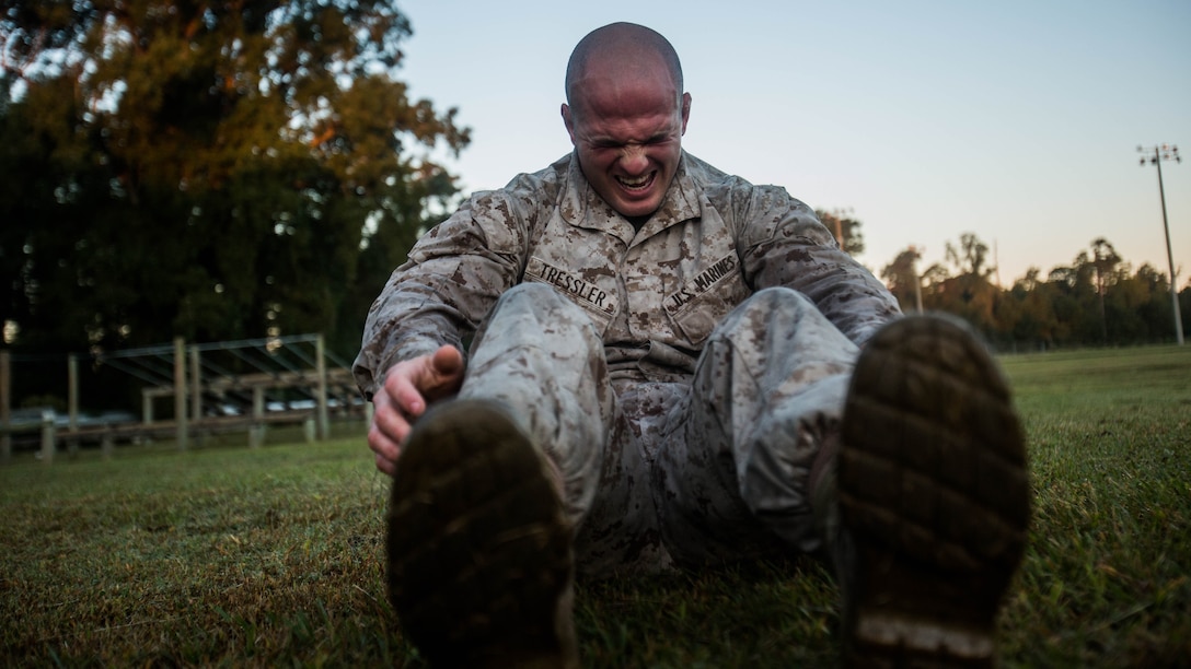 Pfc. Brandon Tressler, scout sniper screener candidate from 3rd Battalion, 6th Marine Regiment, conducts a max set of sit-ups- after completing a 1.5 mile ruck run at Marine Corps Base Camp Lejeune, N.C., Oct. 20, 2015. The screener aims to prepare candidates for the Scout Sniper Basic Course. 