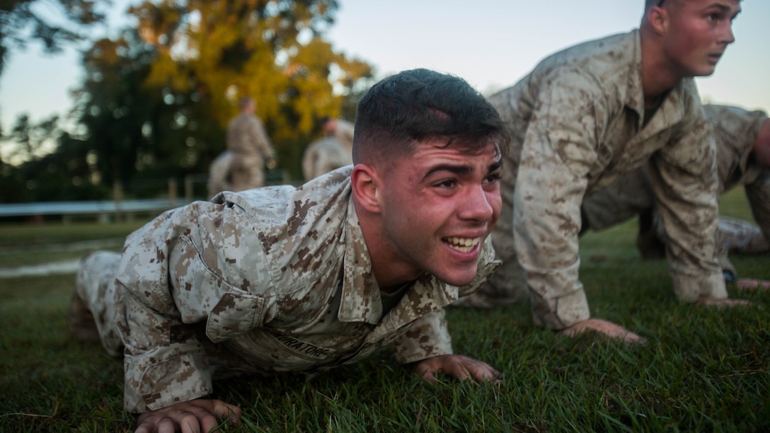 Pfc. Anthony Muratore, scout sniper screener candidate from 3rd Battalion, 6th Marine Regiment, conducts a max set of push-ups after completing a 1.5 mile ruck run at Marine Corps Base Camp Lejeune, N.C., Oct. 20, 2015. The screener aims to prepare candidates for the Scout Sniper Basic Course.